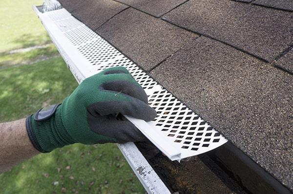 gutter guards are designed to allow water to flow through while blocking leaves, twigs, and other debris from entering the gutter system